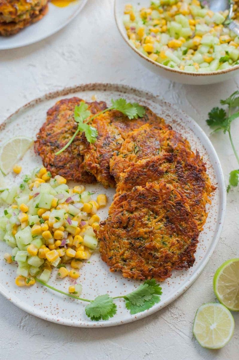 sweet potato and zucchini fritters with cucumber corn salsa viewed from above
