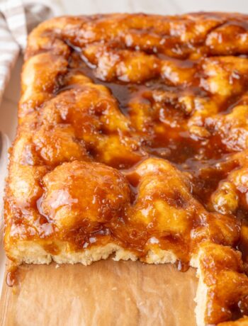 A close-up photo of Brunsviger cake on a wooden board.